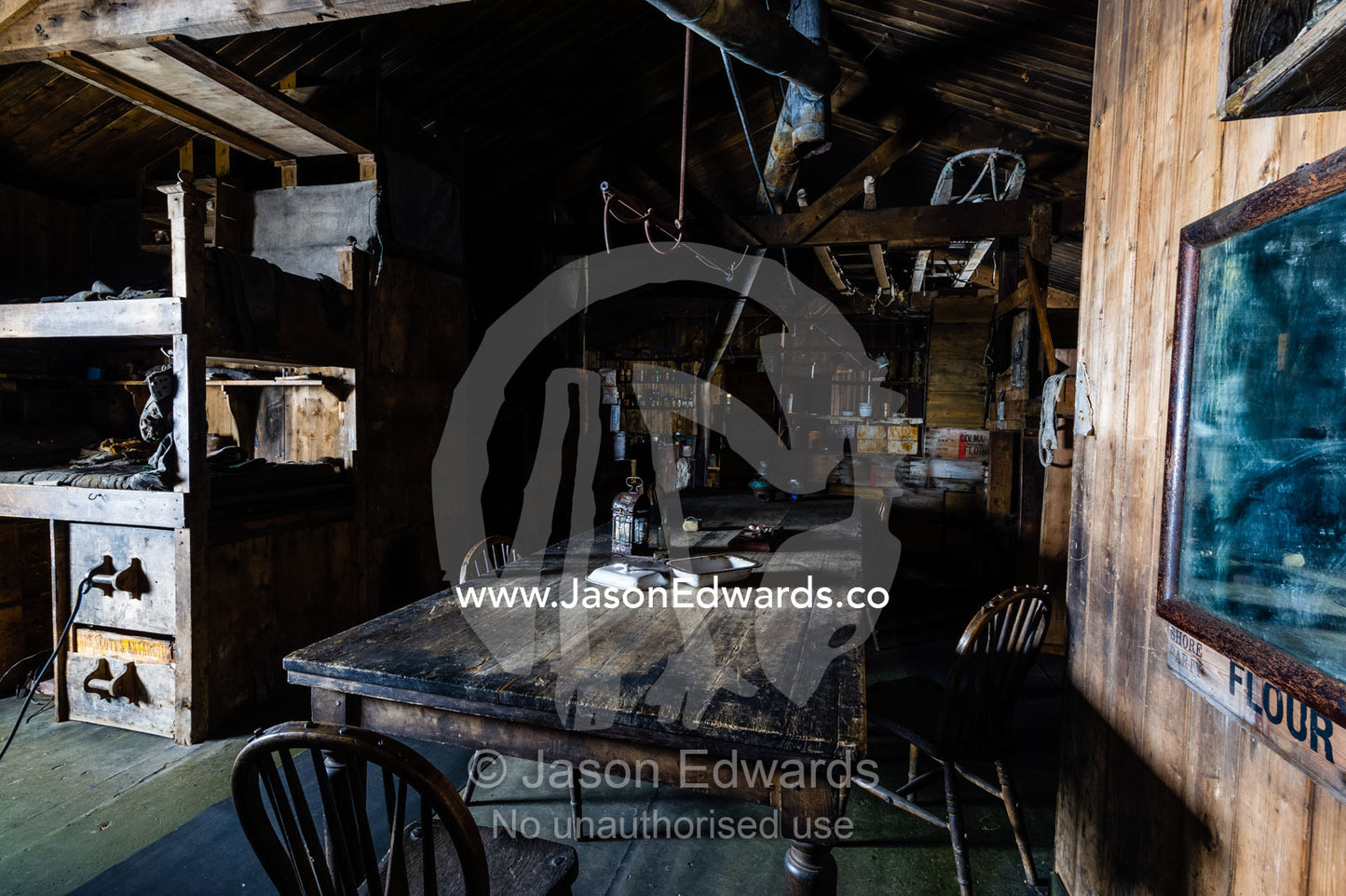 The wardroom table in the Antarctic explorer Robert Falcon Scott's hut. Scott's Hut, Cape Evans, Ross Island, Antarctica.