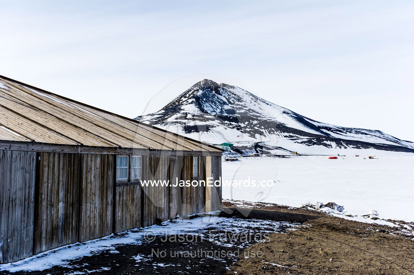 Discovery Hut overlooking Observation Hill in Antarctica. Discovery Hut, Observation Hill, Hut Point, Ross Island, Antarctica.