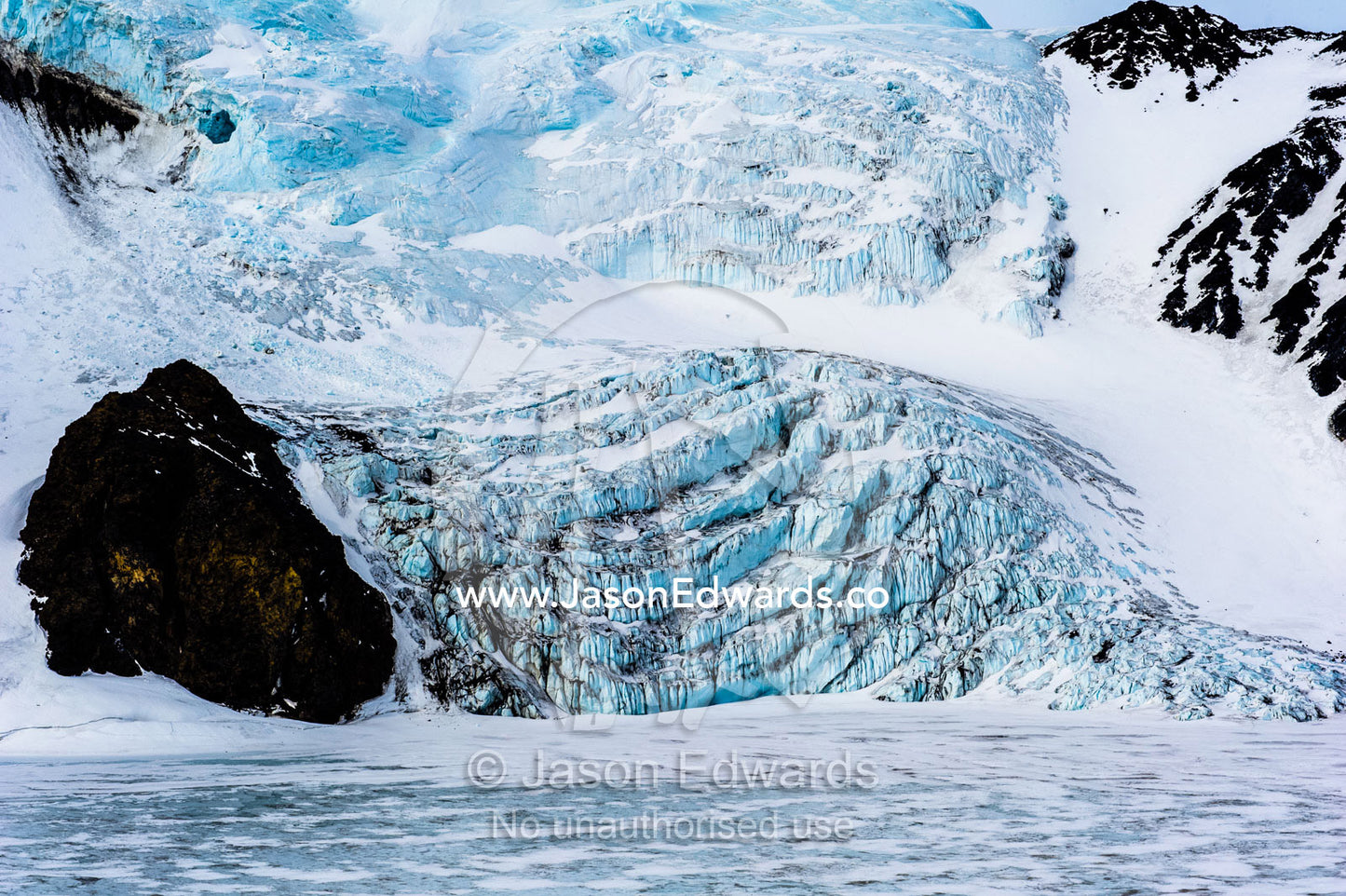 The fracture zone of a glacier cascading onto the sea ice. Turks Head, Turks Head Bay, Ross Island, Antarctica.