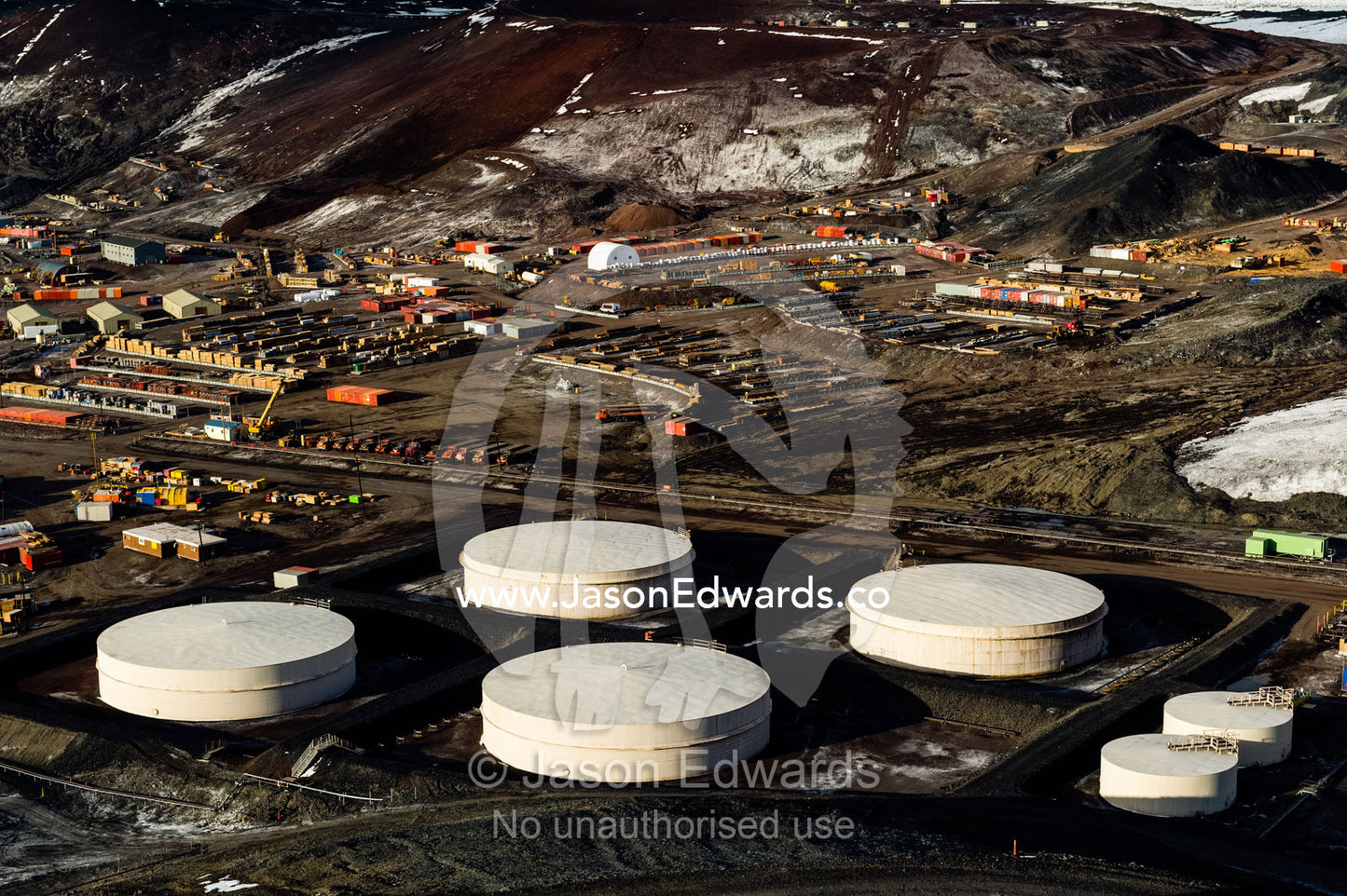 The enormous oil tanks and sprawling facilities of McMurdo Station the largest base in Antarctica. McMurdo Station, Ross Island, Antarctica.