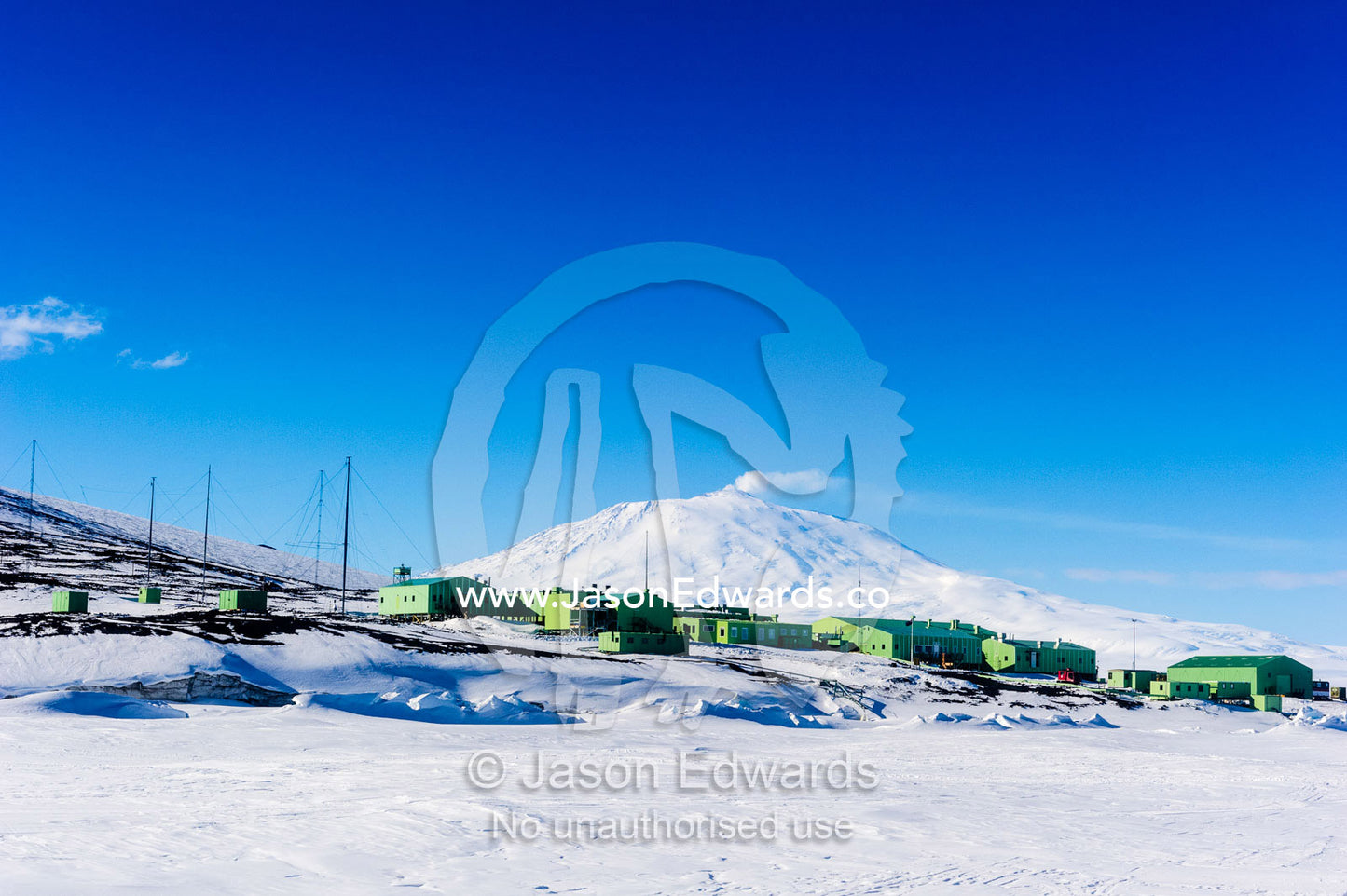 Scott Base resting on the shores of the sea ice beneath Mount Erebus. Scott Base, Mount Erebus, Pram Point, Hut Point Peninsula, Ross Island, Antarctica.