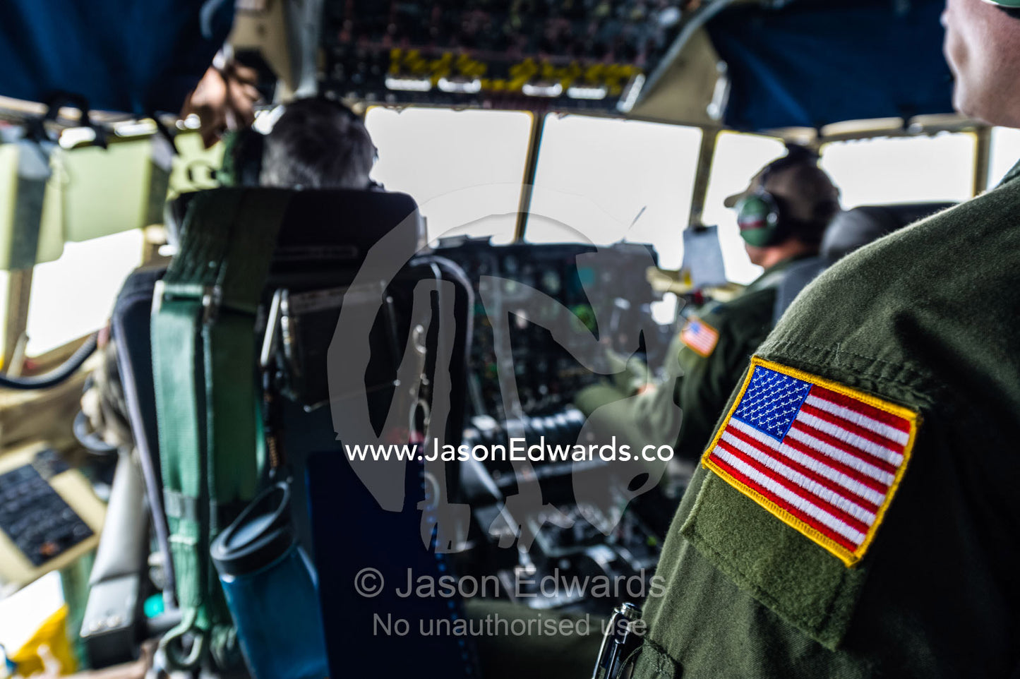 An American flag patch on the uniform of a US air force Hercules flight crew in the cockpit flying to Antarctica. Southern Ocean, between New Zealand and Antarctica.