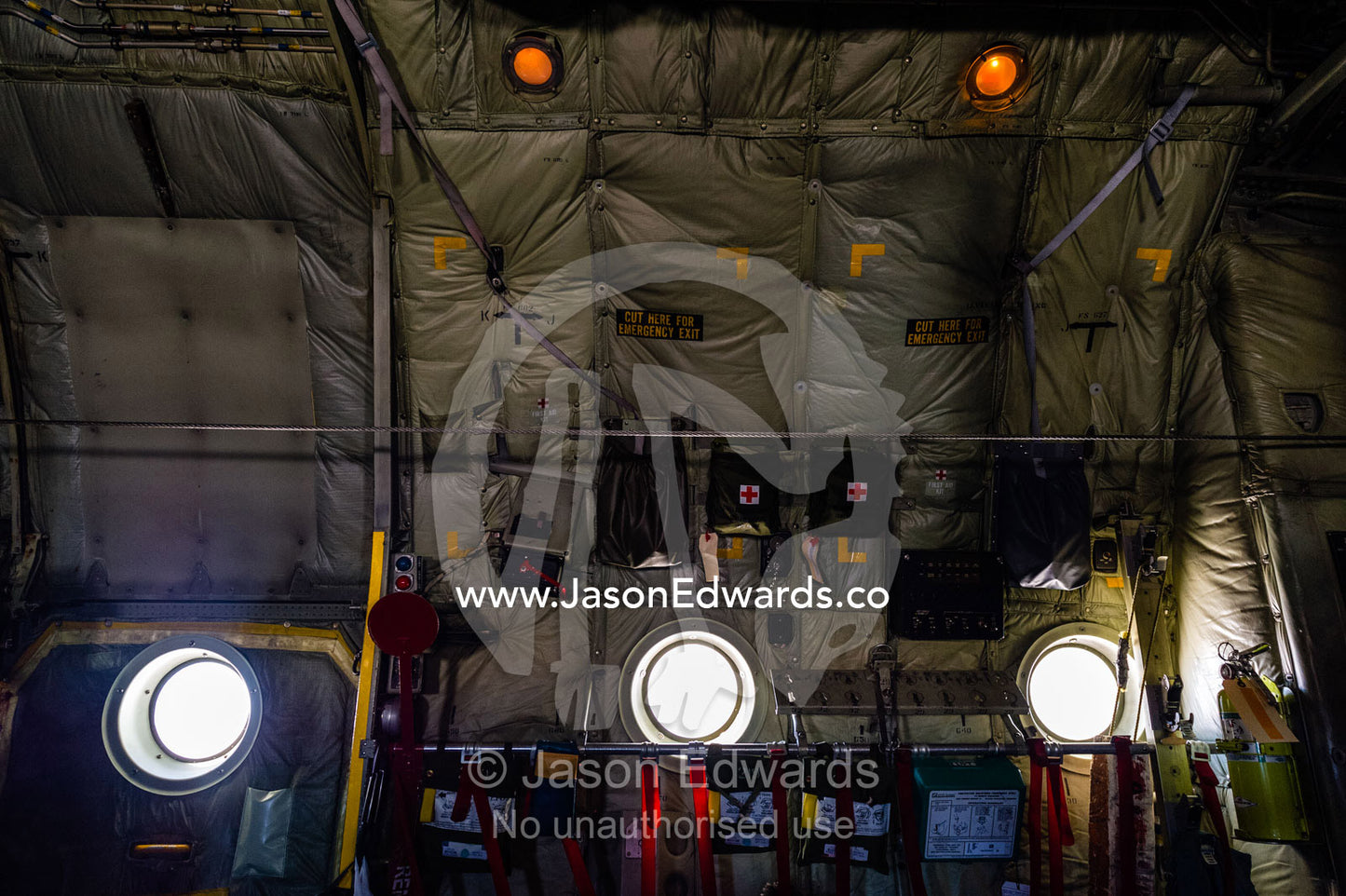The window portals, first aid kits and exposed walls of a US Air force Hercules fuselage. Southern Ocean, between New Zealand and Antarctica.