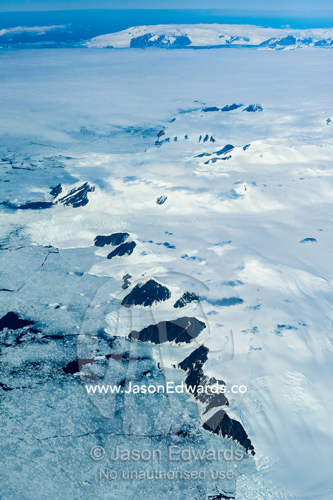 Jagged mountain ranges, glaciers and ice fields cover the Antarctic continent. Northern Victoria Land, Antarctica.