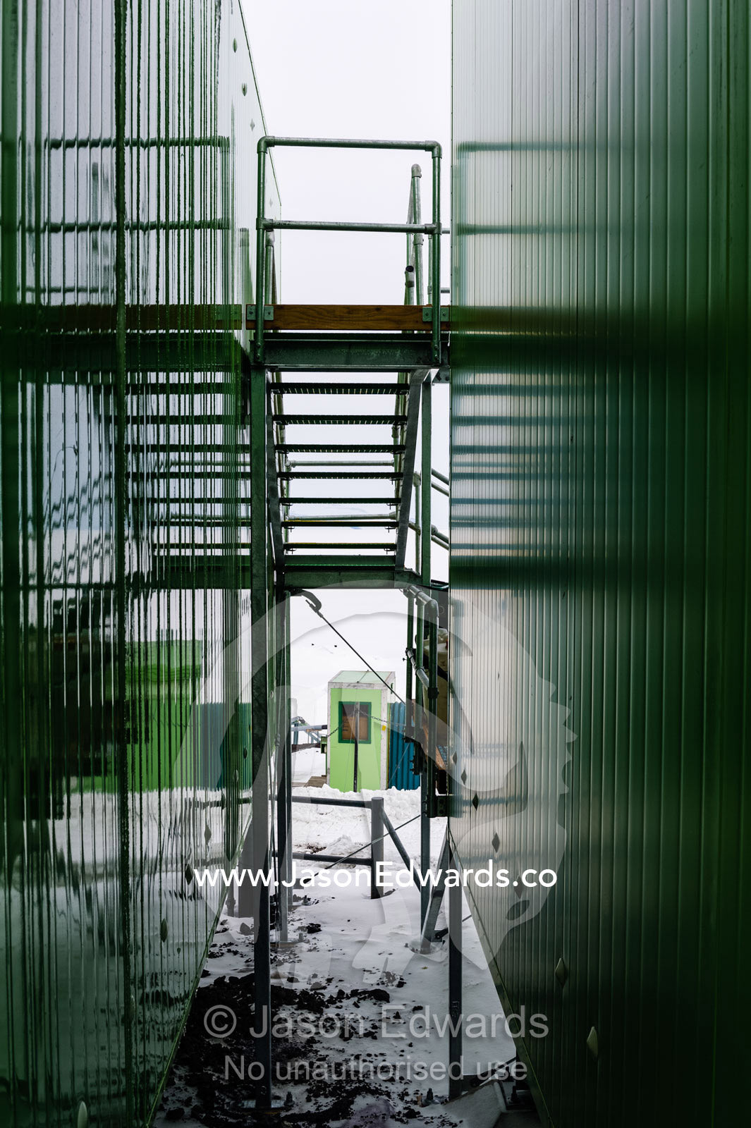 A stairwell leads between two buildings in an Antarctic science base. Scott Base, Pram Point, Hut Point Peninsula, Ross Island, Antarctica.
