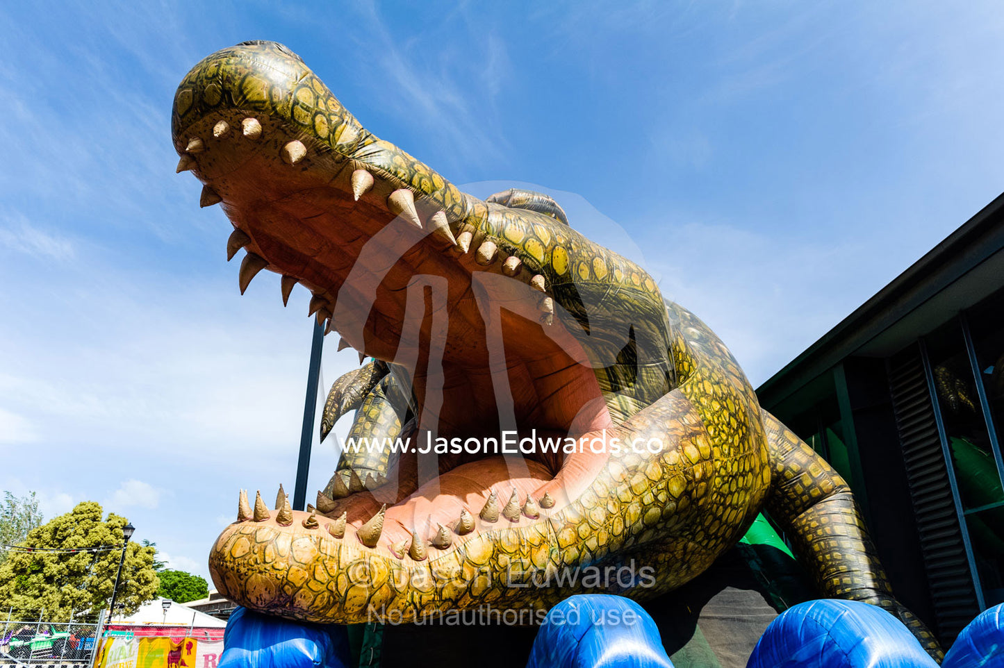 An inflatable crocodile slide at an agricultural show. Royal Melbourne Show, Flemington, Melbourne, Victoria, Australia.