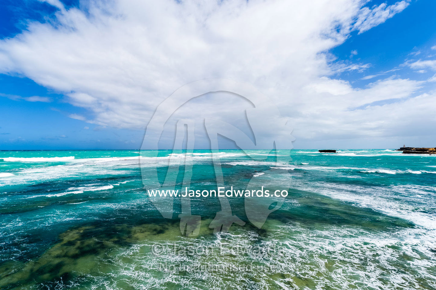 Strong winds whipping waves onto a rugged limestone coastline. Robe, Limestone Coast, South Australia, Australia.
