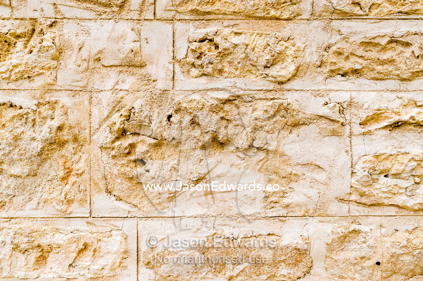 The detail of the bricks in the limestone wall of a church in a rural town. Robe, Limestone Coast, South Australia, Australia.
