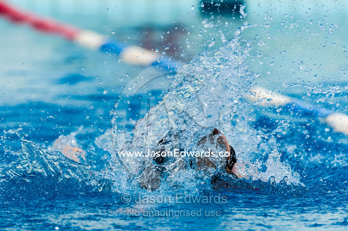 Students competing in races at a school swimming carnival. Fitzroy, Melbourne, Victoria, Australia.