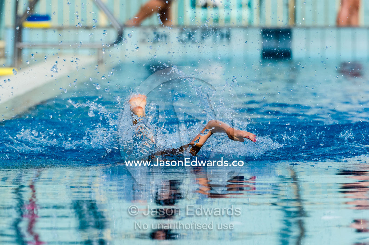 Students competing in races at a school swimming carnival. Fitzroy, Melbourne, Victoria, Australia.