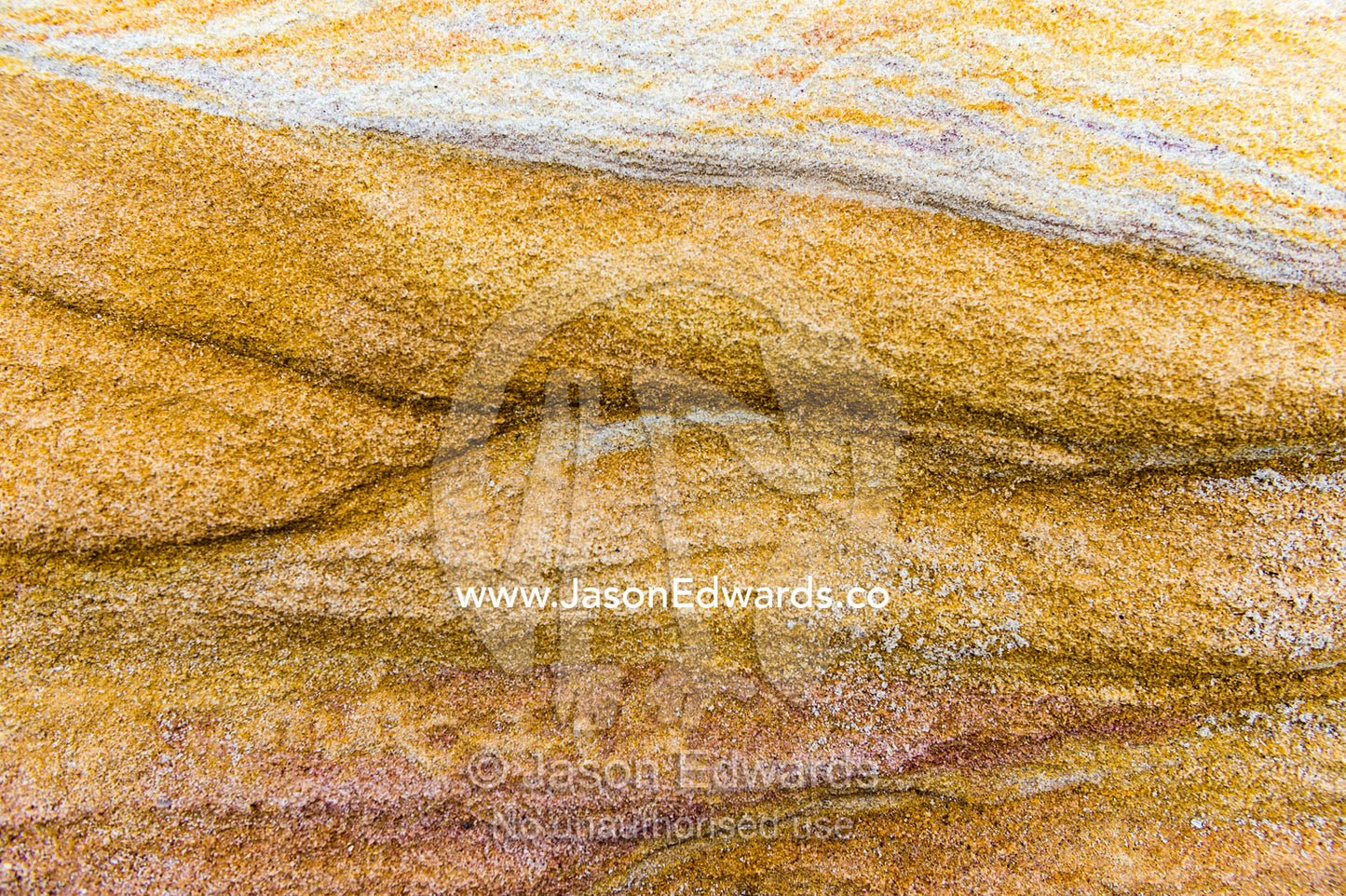 The wave surface on a sandstone beach rock. Bondi Beach, Bondi, Sydney, New South Wales, Australia.