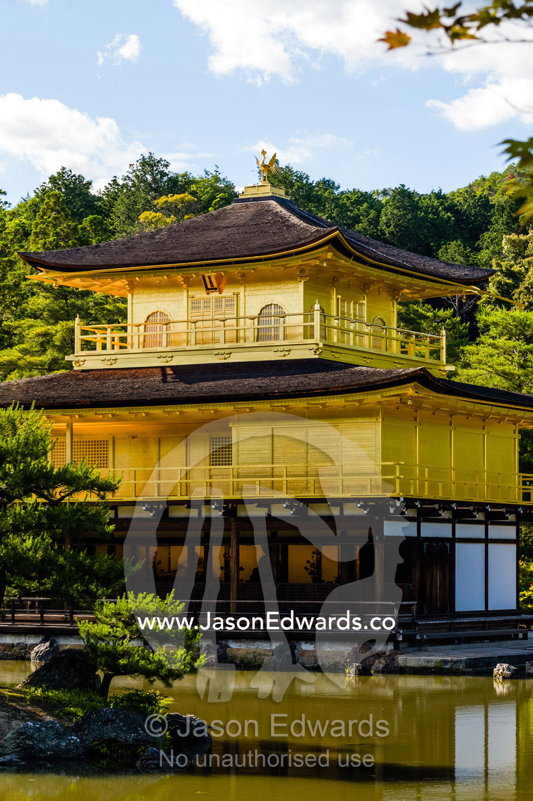 The Temple of the Golden Pavilion on the shore of an ornamental lake. Temple of the Golden Pavilion, Kinkaku-ji, Kyoto, Japan.