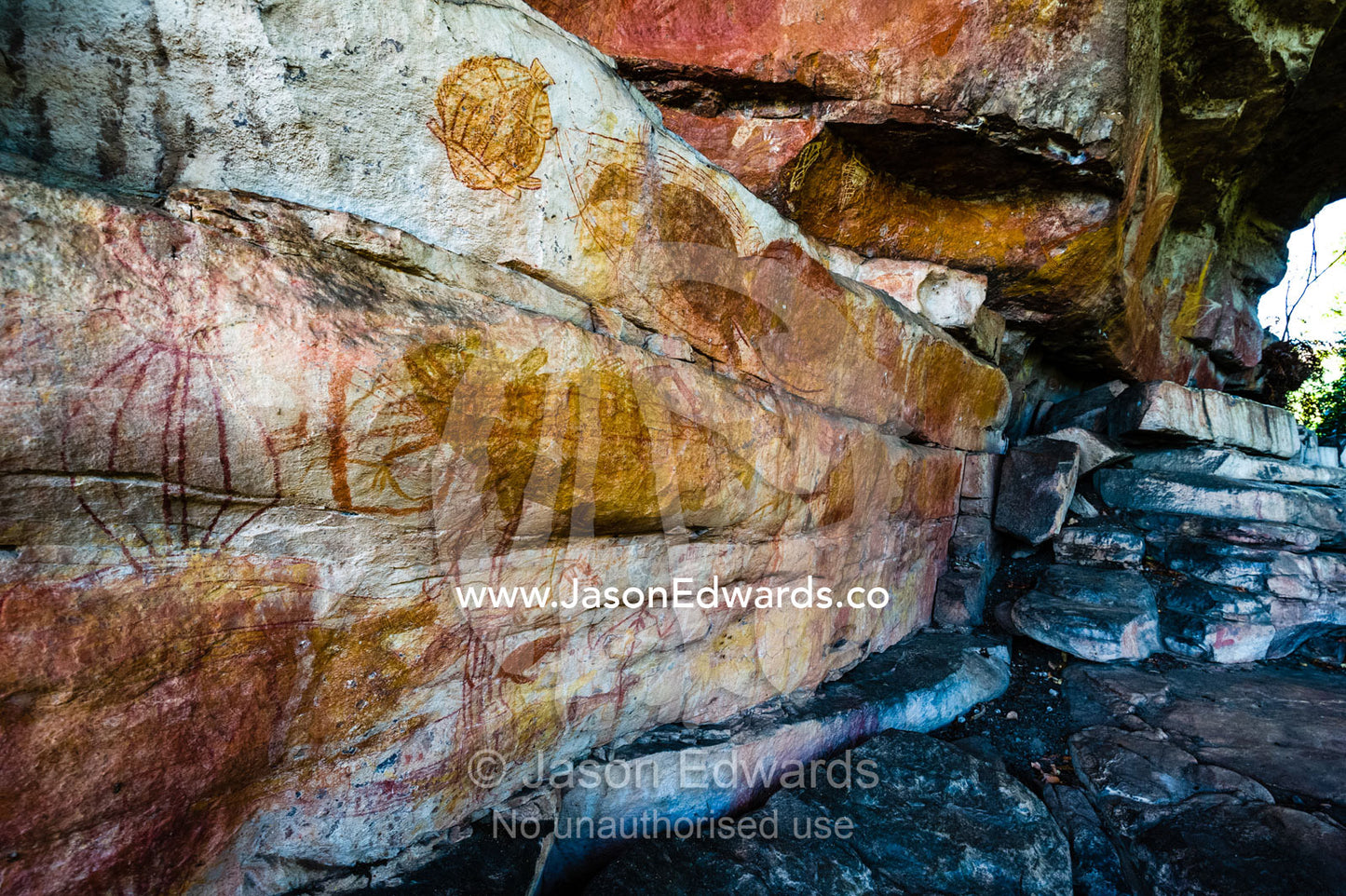 A cliff overhang on a sandstone escarpment protects an ancient Aboriginal rock painting art gallery. Ubirr, Kakadu National Park, Northern Territory, Australia.