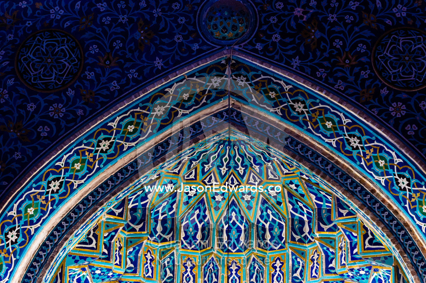 The iridescent blue geometric muqarnas tiled entrance to the Jame Mosque prayer hall. Jame Mosque of Yazd, Yazd, Yazd Province, Islamic Republic of Iran.