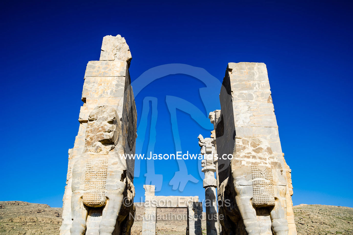 Towering protective gods known as Lamassu at the Gate of All Nations in Persepolis. Persepolis, Shiraz, Fars Province, Islamic Republic of Iran.