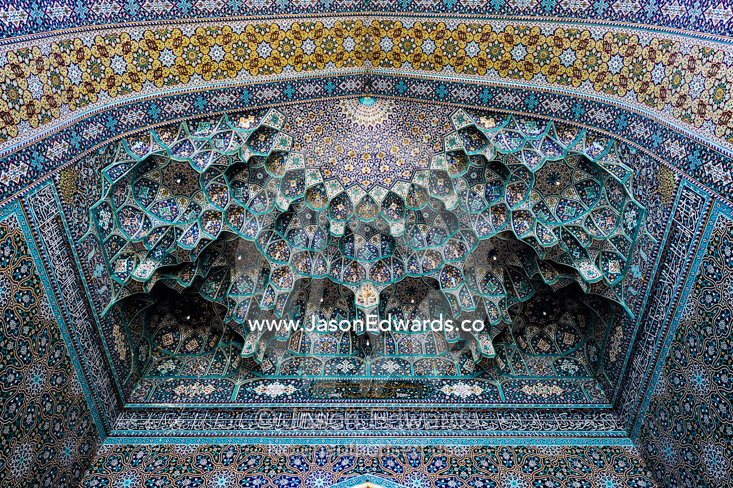 The intricate tiled muqarnas on the vaulted surface of the Holy shrine of Hazrat Masuma. Fatima Masumeh Shrine, Qom, Qom Province, Islamic Republic of Iran.
