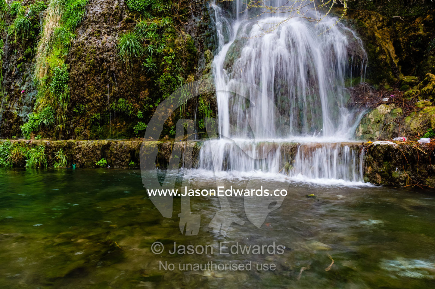 A small waterfall cascades into a mountain pool. Niasar, Neyasar District, Kashan County, Isfahan Province, Islamic Republic of Iran.
