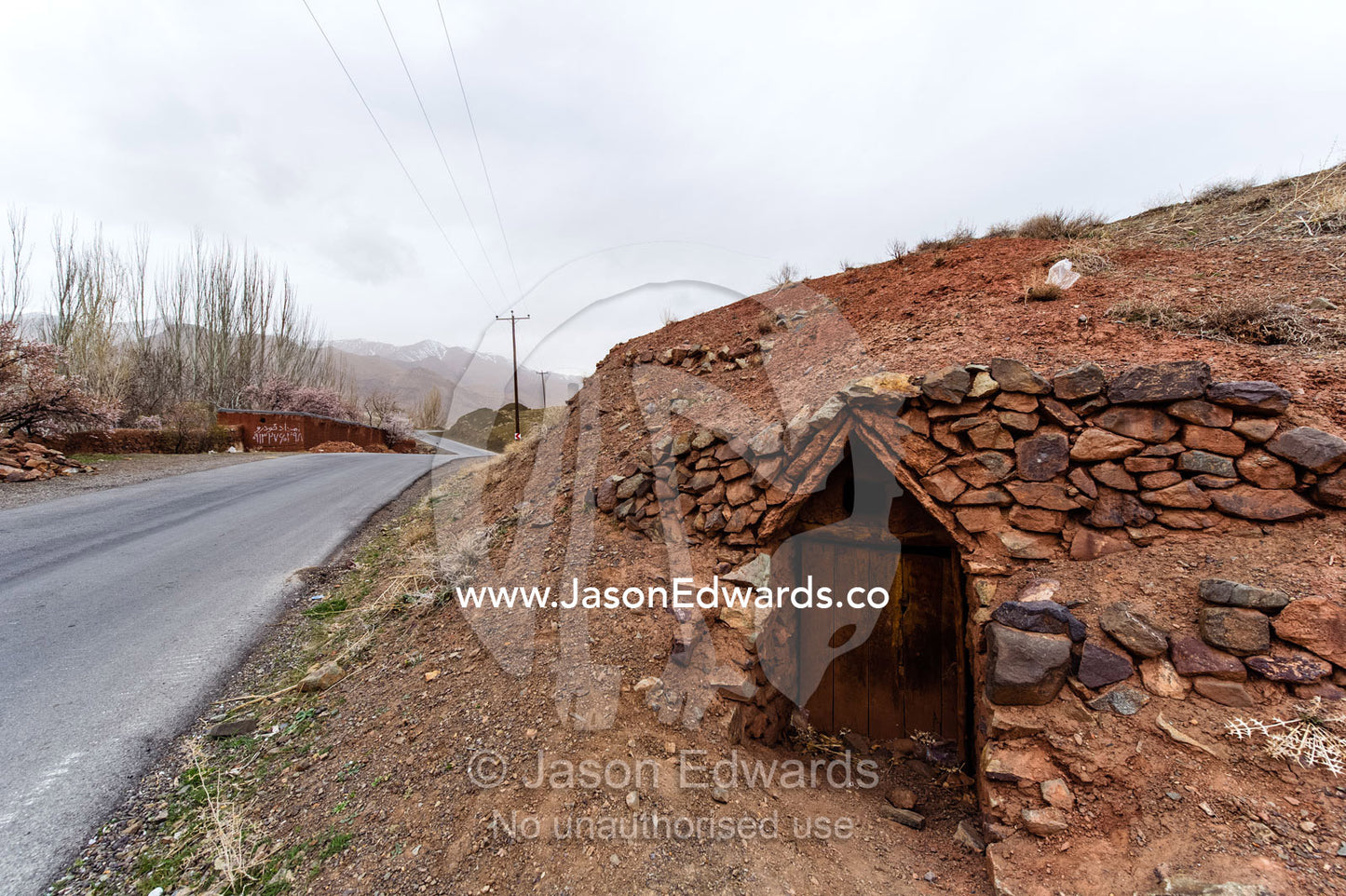 Caves dug into a hillside to shelter sheep during the mountain winters. Abyaneh, Barzrud Rural District, Natanz County, Isfahan Province, Islamic Republic of Iran.