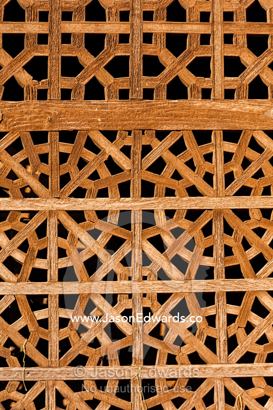 A carved timber lattice screen covers a window opening. Abyaneh Village, Abyaneh, Barzrud Rural District, Natanz County, Isfahan Province, Islamic Republic of Iran.