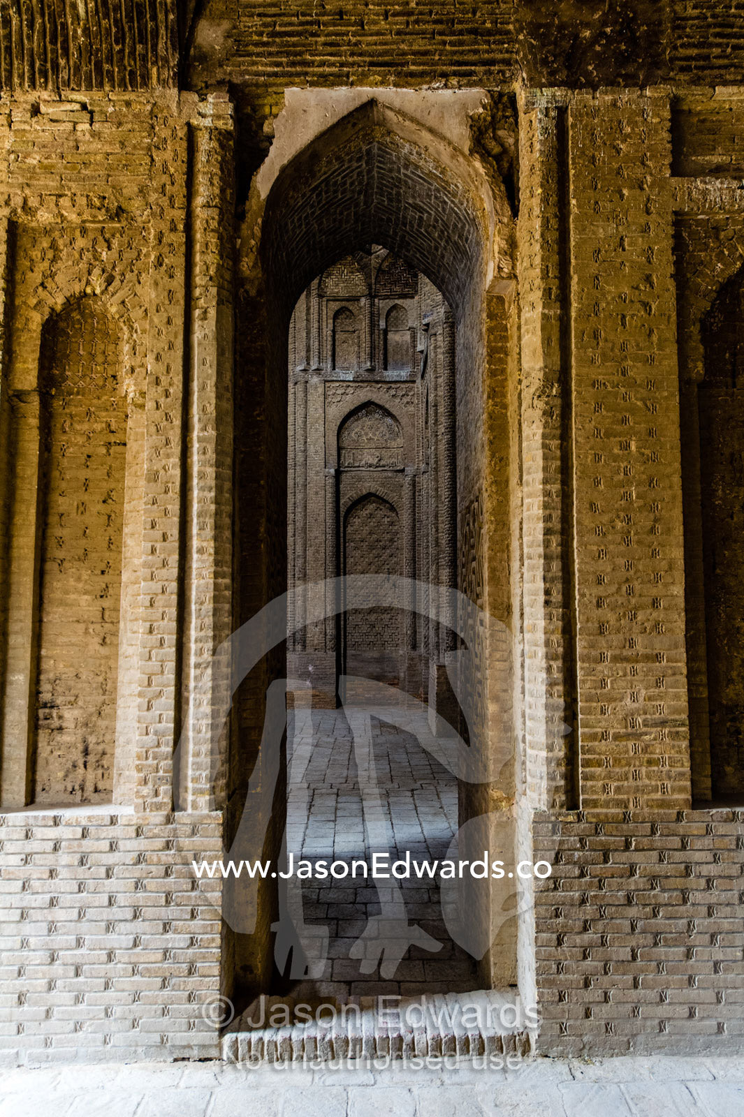 An ornate series of stone doorways leading through a mosque. Jameh Mosque of Isfahan, Isfahan, Isfahan Province, Islamic Republic of Iran.