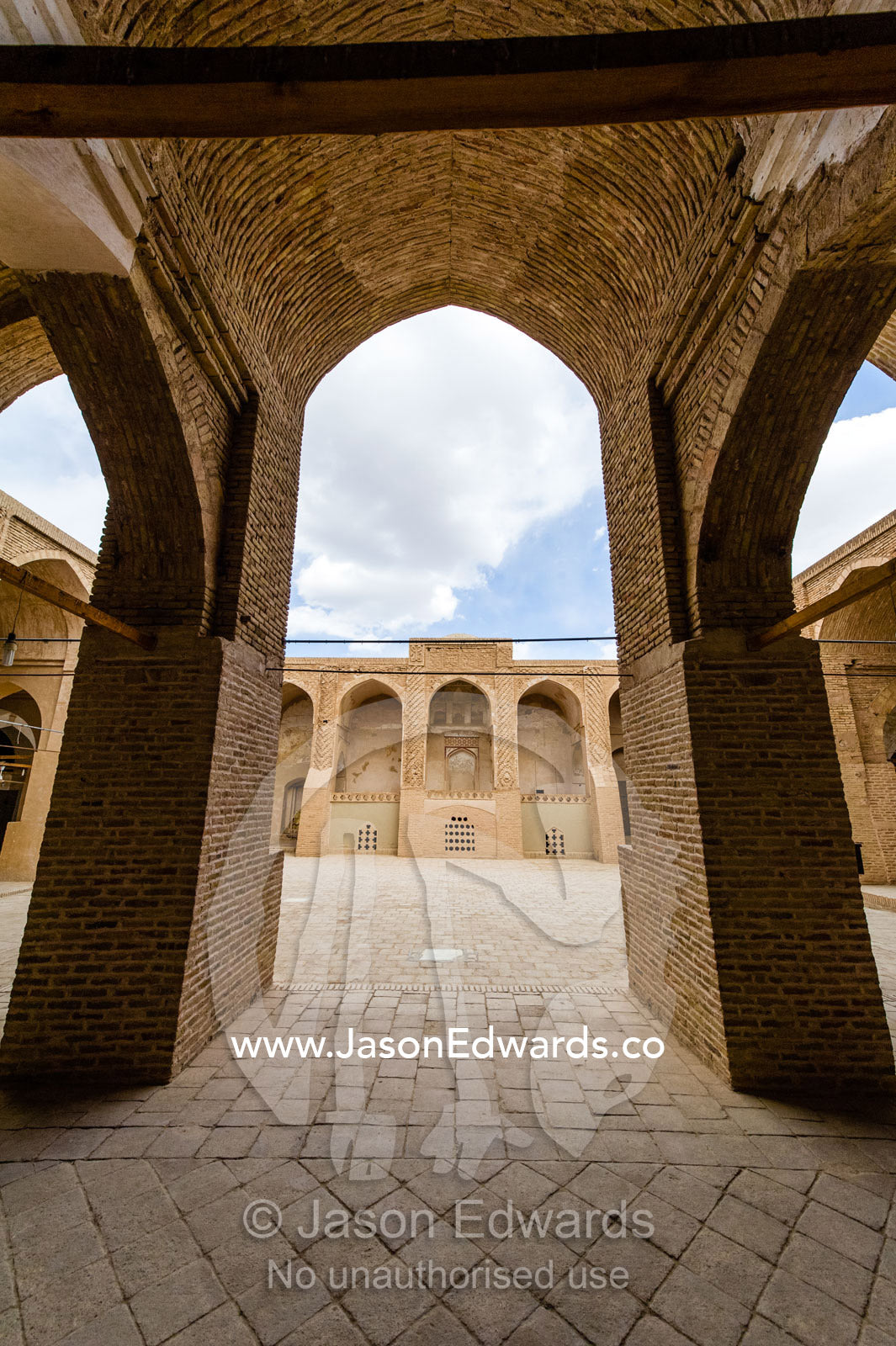 The paved main courtyard the Jame Mosque as seen through the riwaq. Jameh Mosque of Nain, Nain, Nain County, Isfahan Province, Iran.