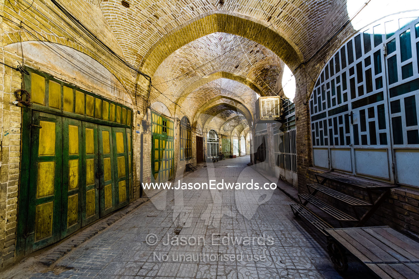 The vaulted ceiling of an ancient bazaar where shops are closed the a public holiday. Yazd, Yazd Province, Islamic Republic of Iran.