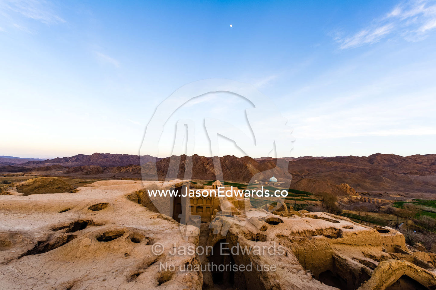 Looking across the rooftops of crumbling handmade brick ruins of an ancient abandoned village in the desert. Kharanagh, Yazd, Yazd Province, Islamic Republic of Iran.
