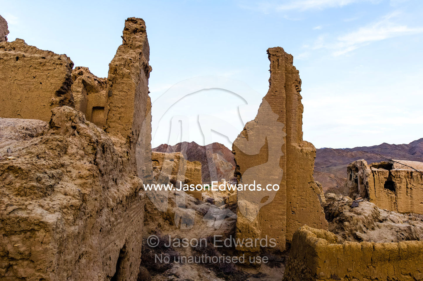 The crumbling handmade brick ruins of an ancient abandoned village in the desert. Kharanagh, Yazd, Yazd Province, Islamic Republic of Iran.