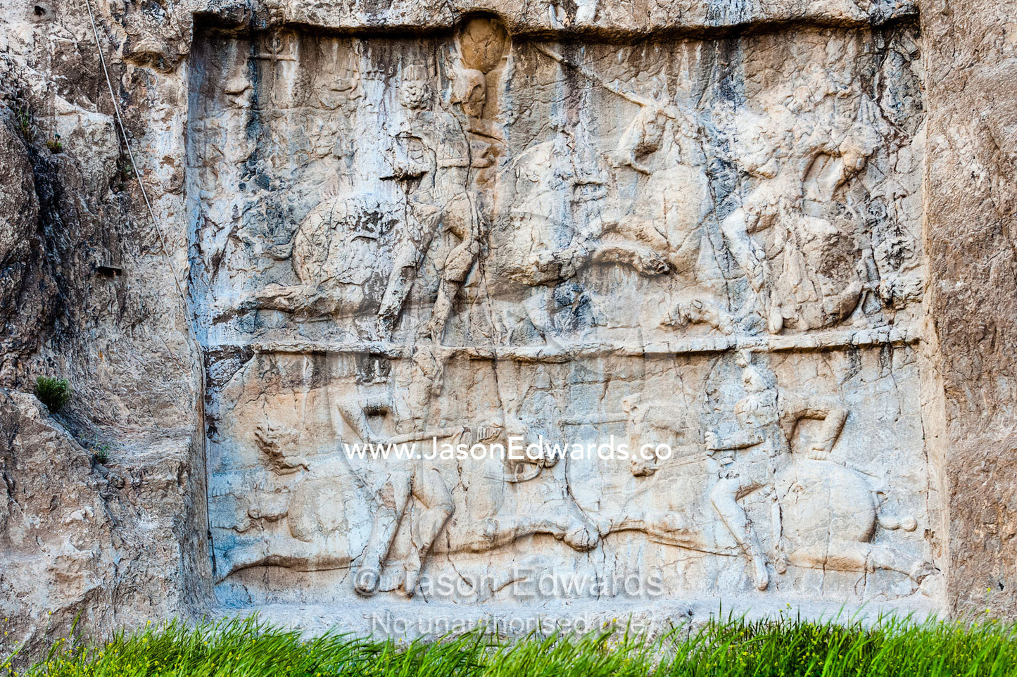 A carving of the Battle by King Bahram 2nd and his victory against enemies at the archeological site of Naqsh-e Rustam also known as the Necropolis. Tombs of the Kings, Naqsh-e Rustam, Fars Province, Islamic Republic of Iran.