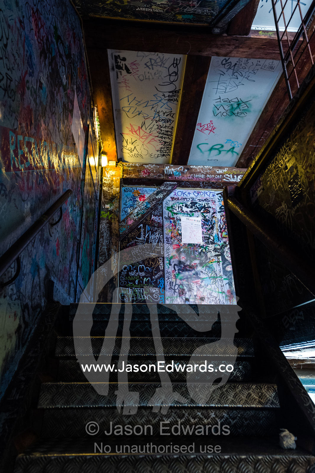 Graffiti in a steel stairwell in a dilapidated building. Christiania, Freetown Christiania, Christianshavn, Copenhagen, Denmark.