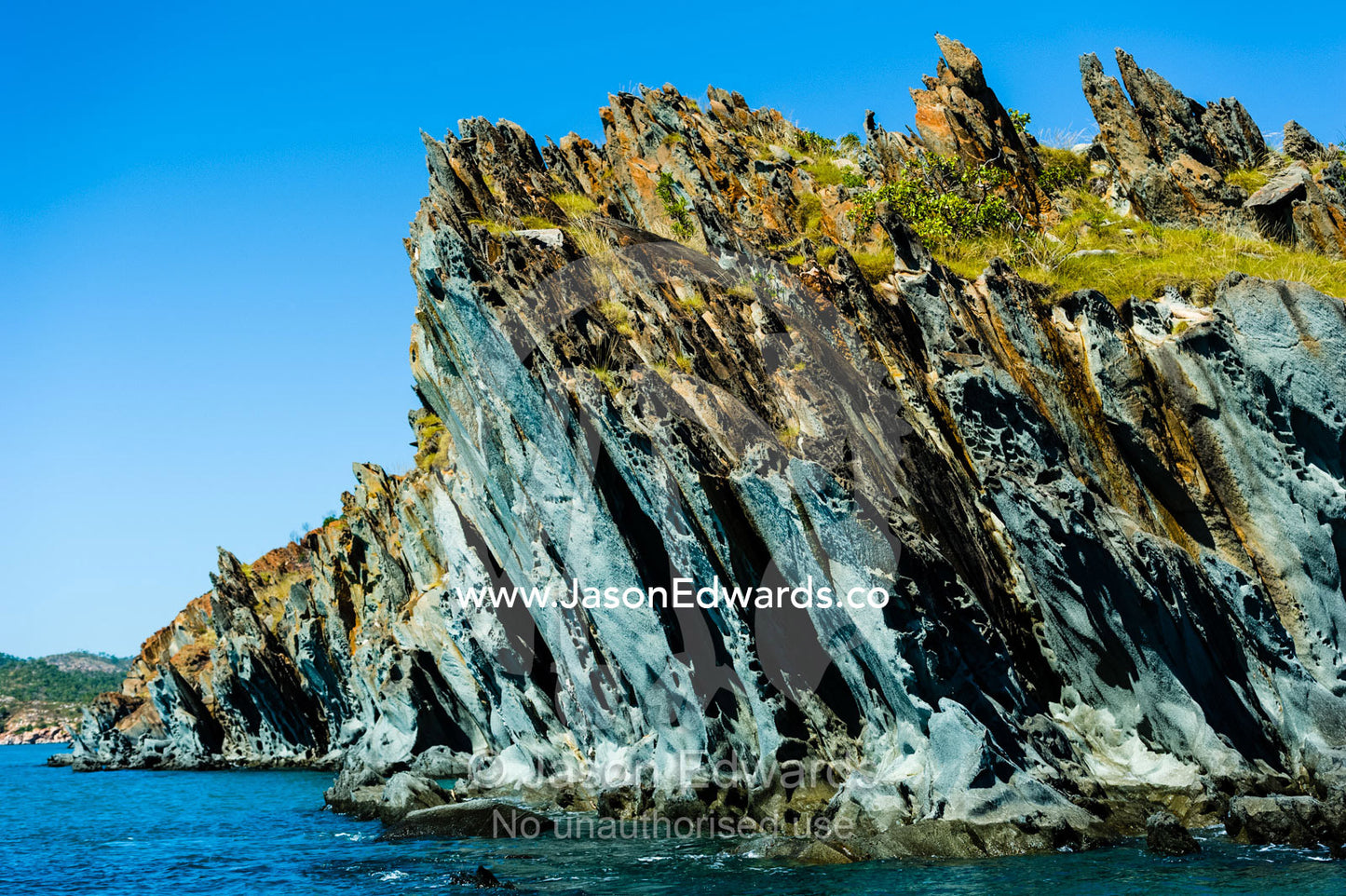 A jagged elgee sandstone formation along a coastline. near Cockatoo Island, Yampi Sound, Buccaneer Archipelago, Kimberley Coast, Western Australia, Australia.