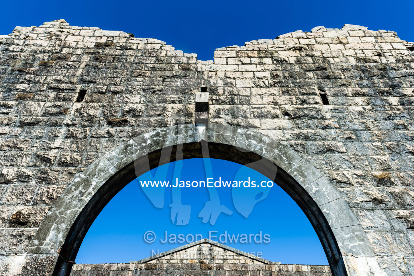 A limestone archway in an abbey in an antique prison. Trial Bay Goal, Laggers Point, Arakoon National Park, New South Wales, Australia.