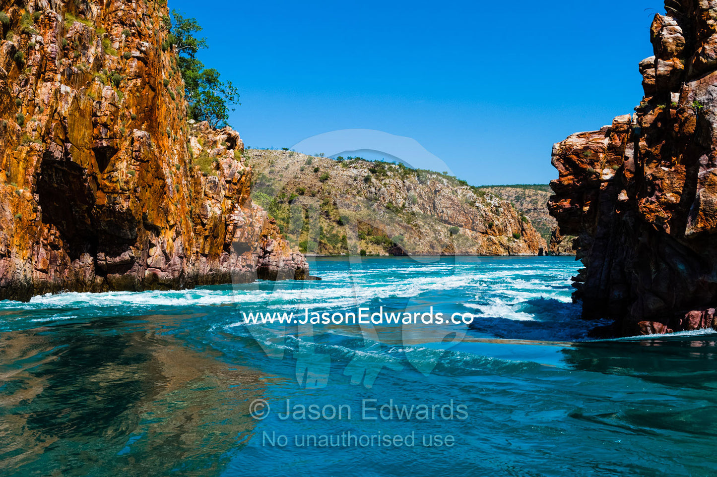 A fast moving tidal flow through a narrow gorge beneath the high tide mark. Horizontal Falls, McLarty Range, Talbot Bay, Buccaneer Archipelago, Kimberley Coast, Western Australia, Australia.
