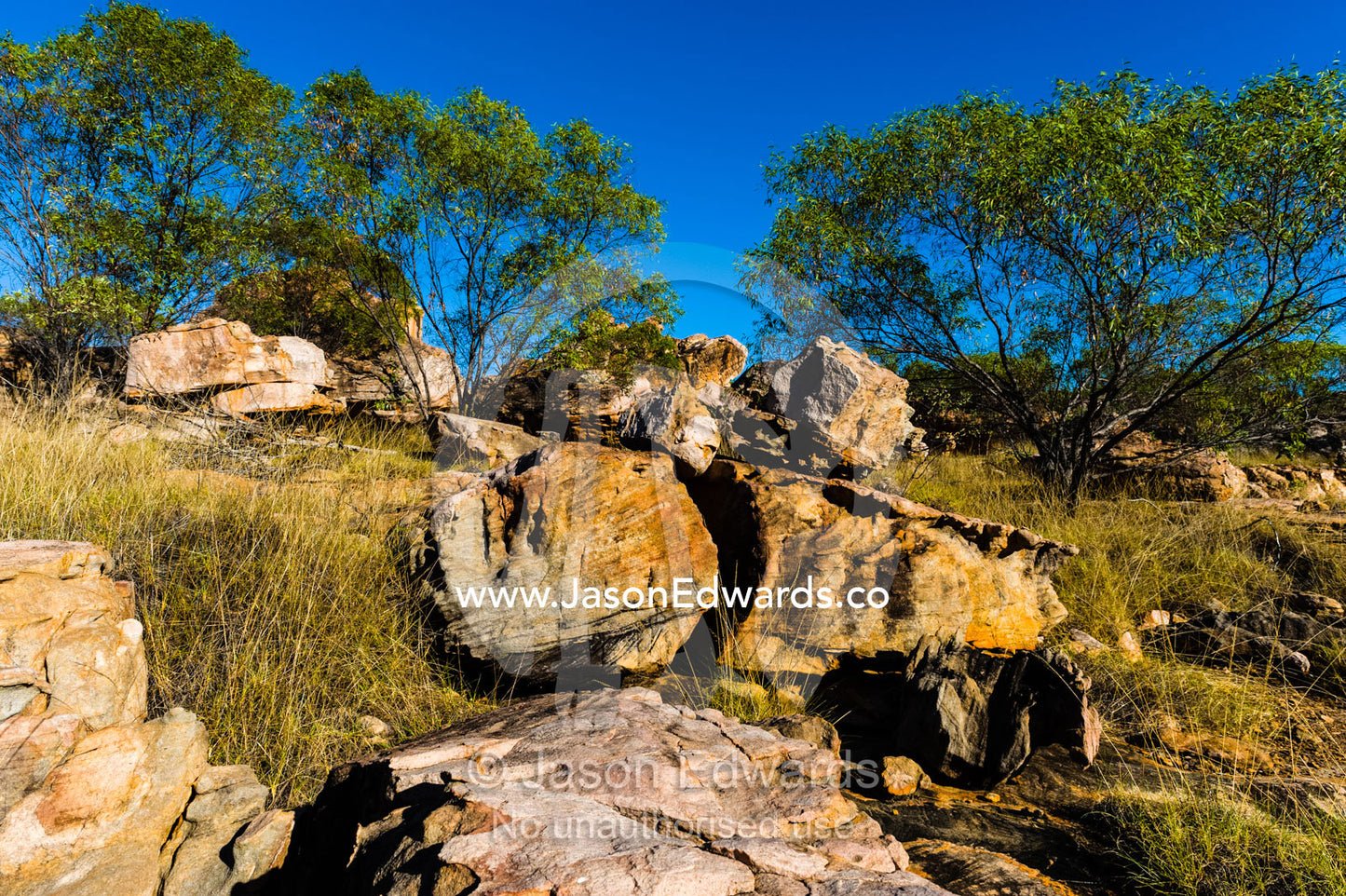 Boulders on the rocky foreshore of remote desert island. Jar Island, Vansittart Bay, Kimberley Coast, Western Australia, Australia.