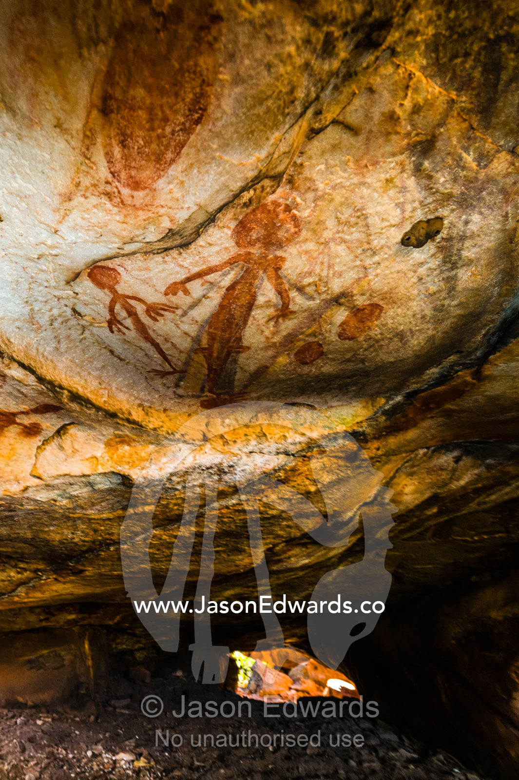 Ancient Aboriginal Gwion Gwion rock paintings also know as Bradshaw rock art featuring a human figures estimated at 50,000 years old on a cave wall. Jar Island, Vansittart Bay, Kimberley Coast, Western Australia, Australia.