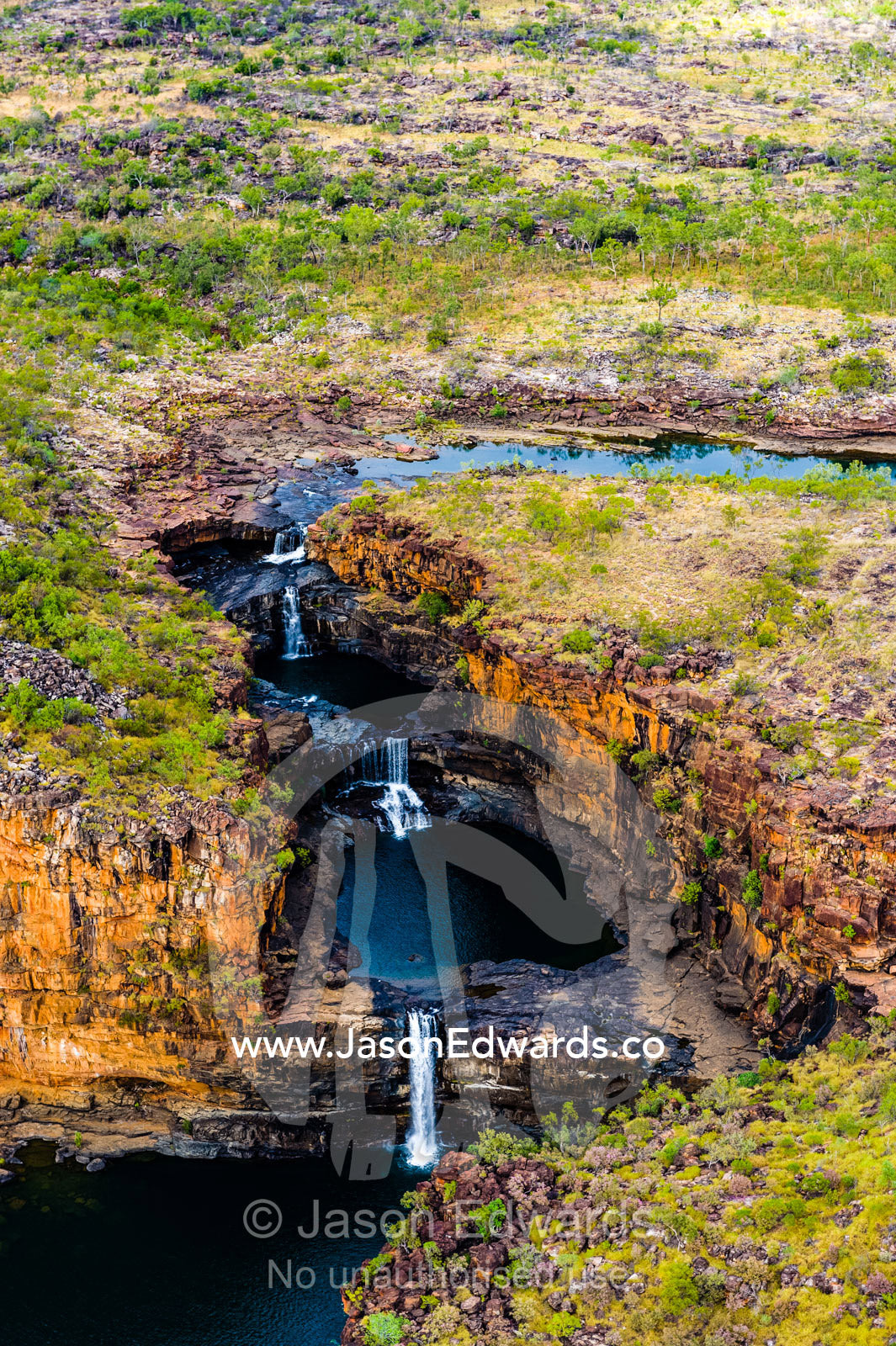 The Mitchell River winds it's way over a plateau before cascading in waterfalls. Mitchell Falls, Mitchell River National Park, Mitchell Plateau, Kimberley Coast, Western Australia, Australia.