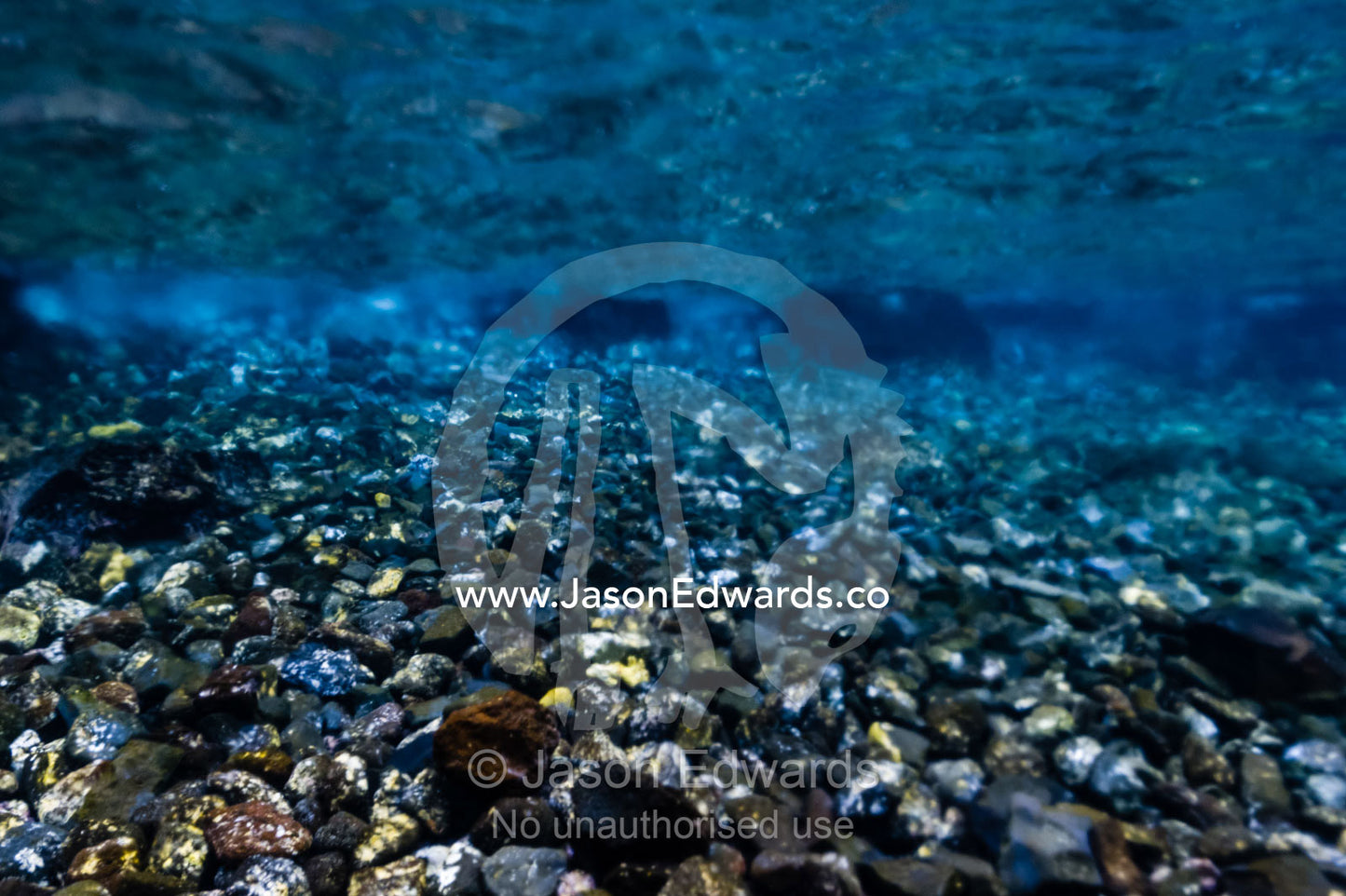 The blurry oily appearance of the water where super-heated water from a volcanic vent is entering the ocean. Lava Flow, Banda Neira, Banda Islands, Maluku Province, Indonesia.