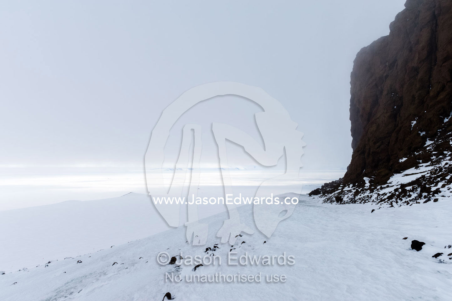 Snow and ice in the lee of a mountain in Antarctica. Castle Rock, Ross Island, Antarctica.