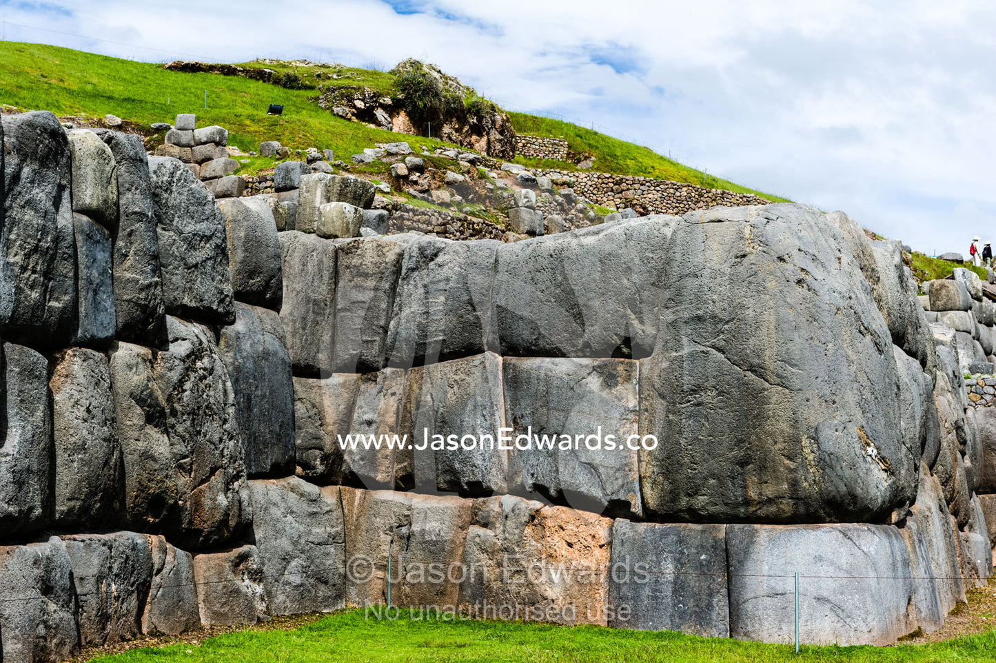 The Inca carved interlocking dry-stone walls from boulders to build a citadel terrace wall. Cusco, Peru.