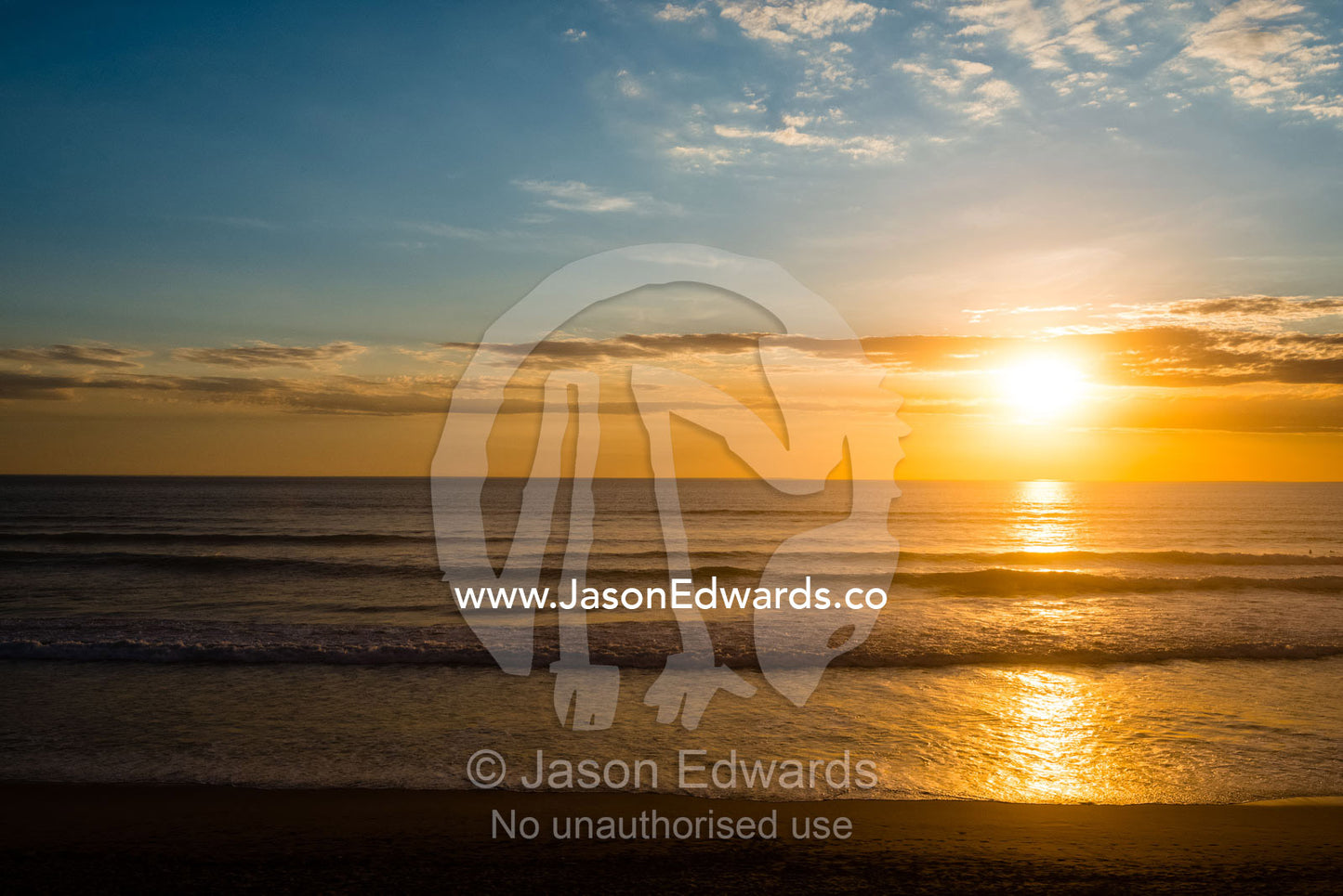 Sunset descends across a wide beach in summer. Victoria, Australia.