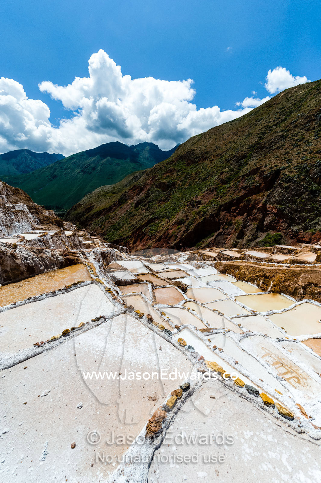 An Inca salt mine made up of salty spring water ponds evaporating. Maras, Peru.