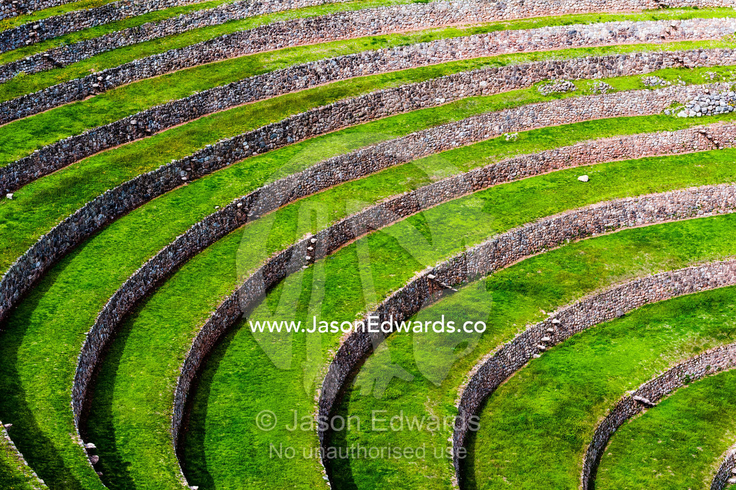 An Inca site with stone wall terraces for growing agricultural crops by creating microclimates. Maras, Peru.