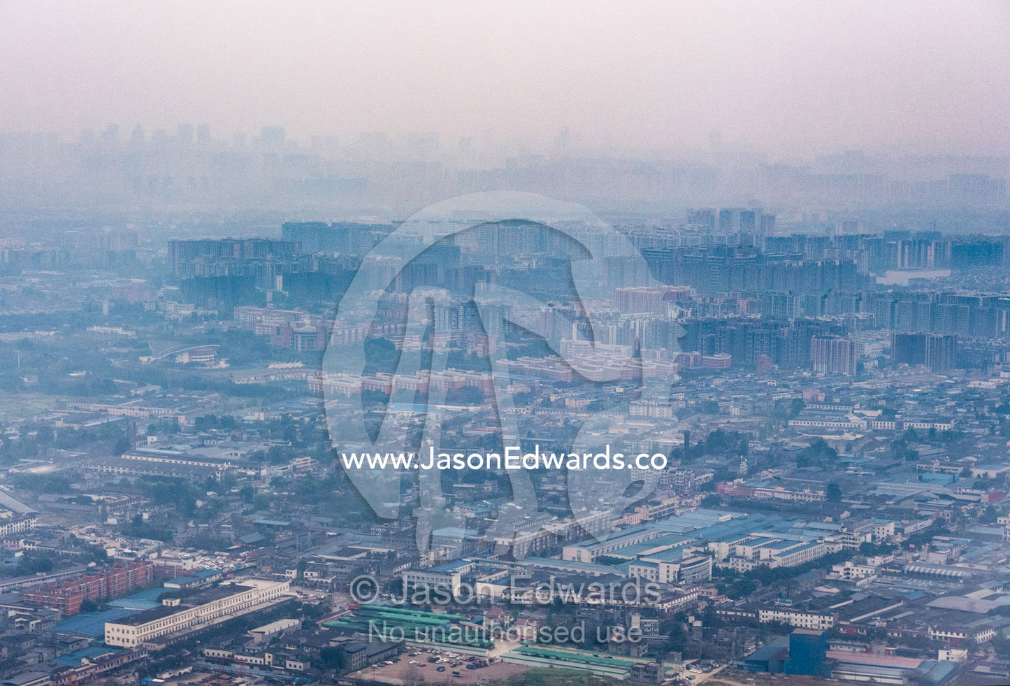 Pollution over a crowded city and suburbs in Western China. Chengdu, Sichuan Province, China