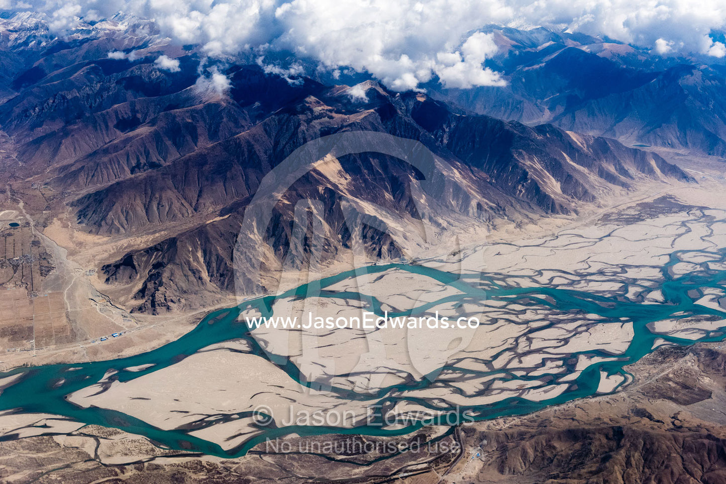Erosion from meltwater carves winding rivers and valleys in the Himalaya Mountains. Himalaya Mountains, Tibet Autonomous Region, Tibet