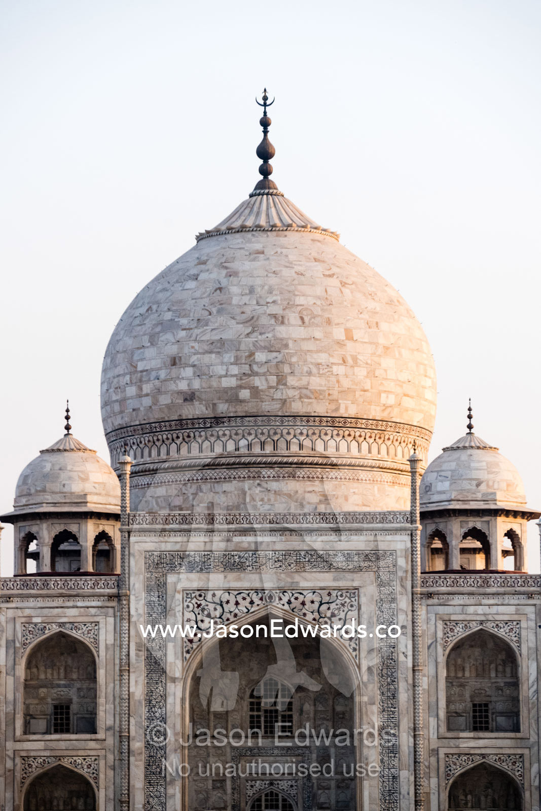 The enormous onion-shaped marble dome and finial crowning a tomb and smaller chattri domes. Agra, Taj Mahal, Uttar Pradesh, India