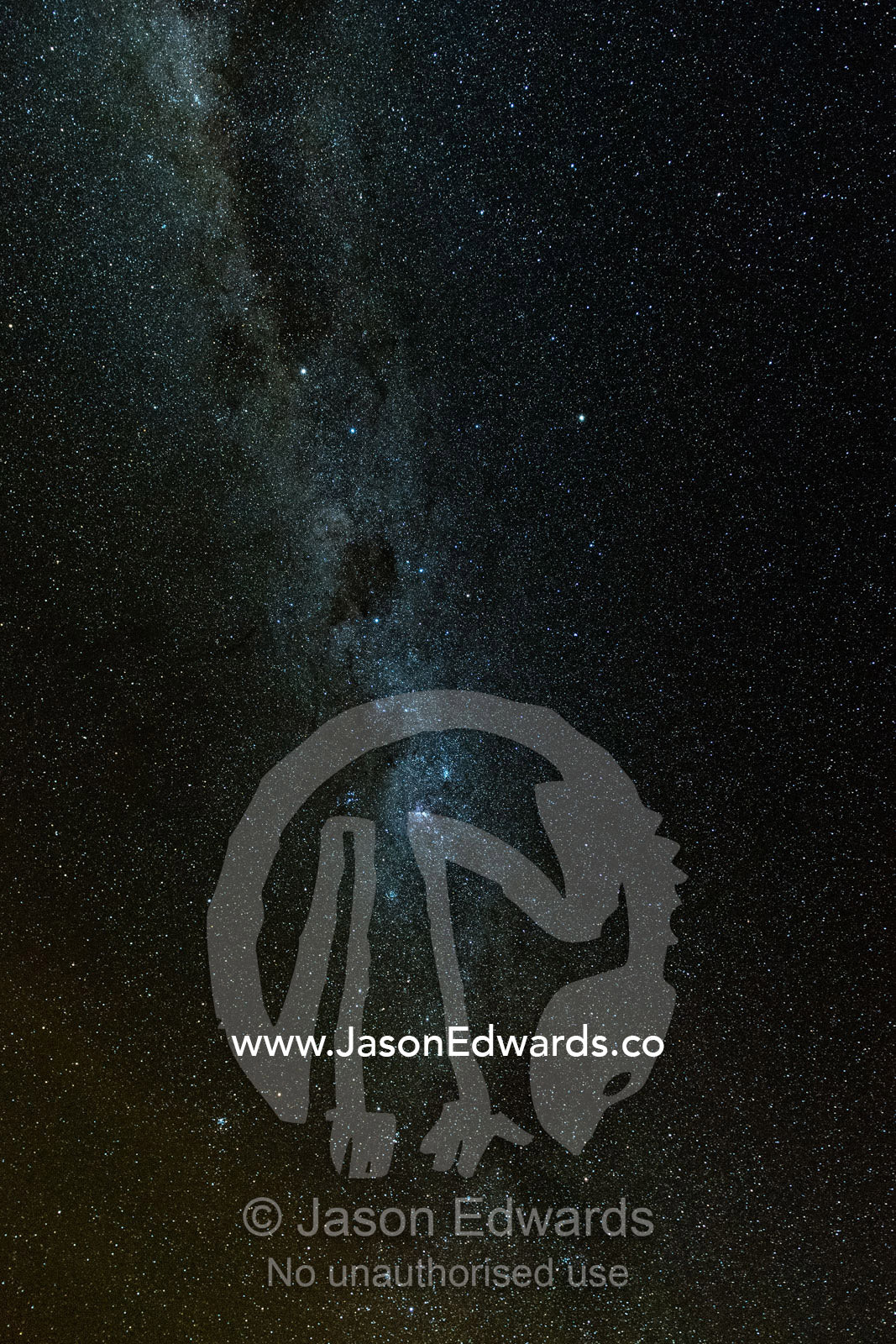 The Milky Way Galaxy and stars fill the night sky above the desert. Namatjira, Ipolera Out Station, Northern Territory, Australia