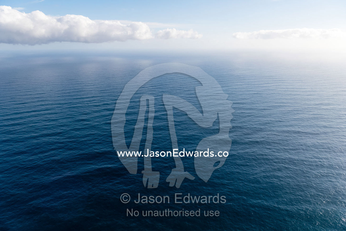 An aerial view of a wide ocean off the Cape of Good Hope. Cape Point National Park, South Africa
