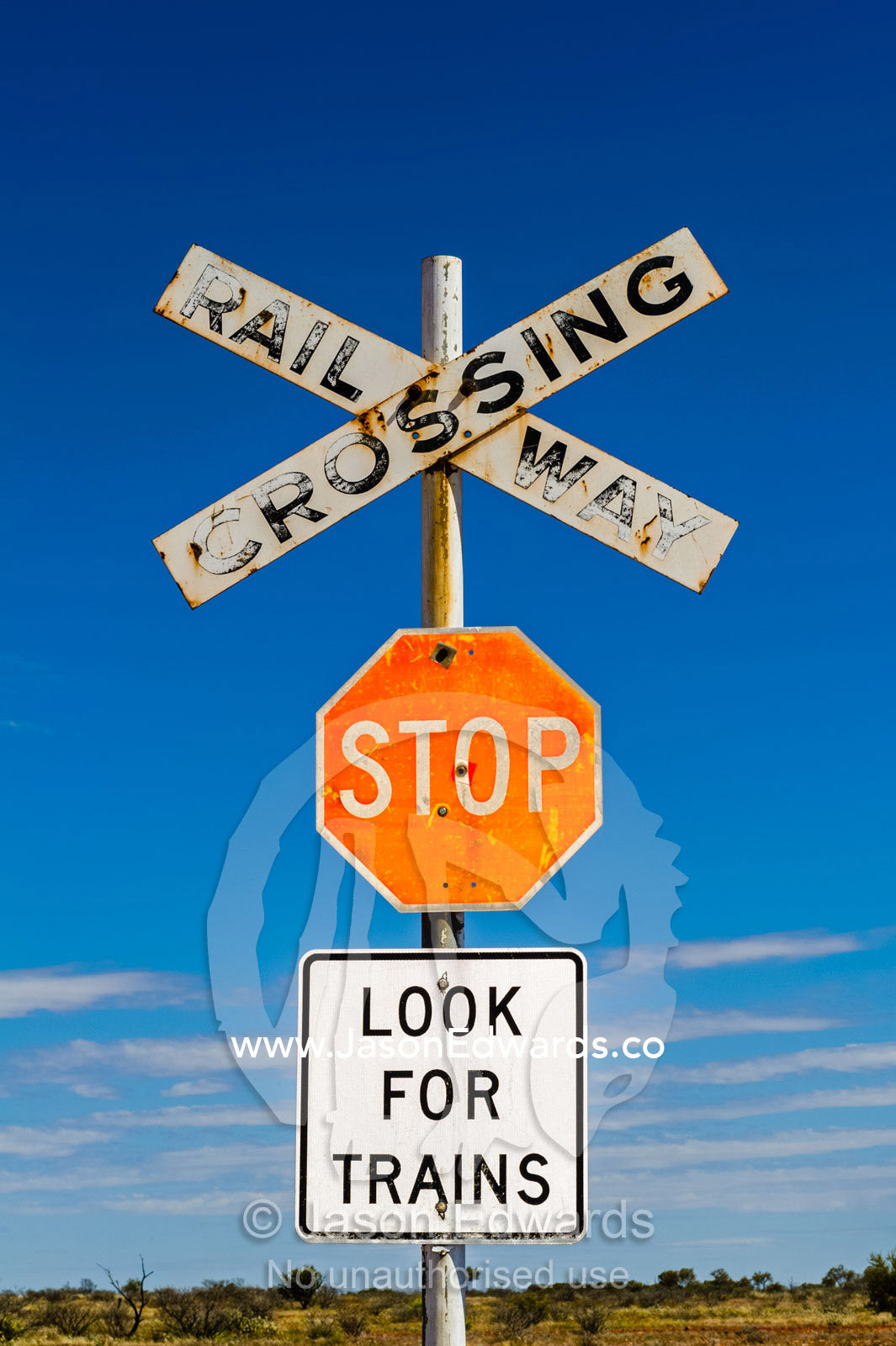 A warning sign at a railway crossing in the remote desert. Coober Pedy, South Australia, Australia