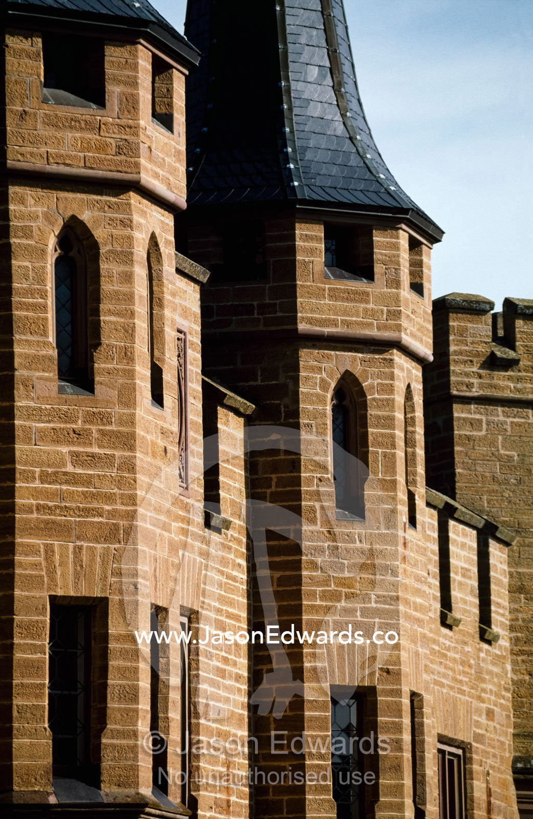 Tower battlements and parapets on the neo-Gothic Hohenzollern Castle. Hohenzollern Castle, Swabian Alb, Baden-Wurttemberg, Germany.