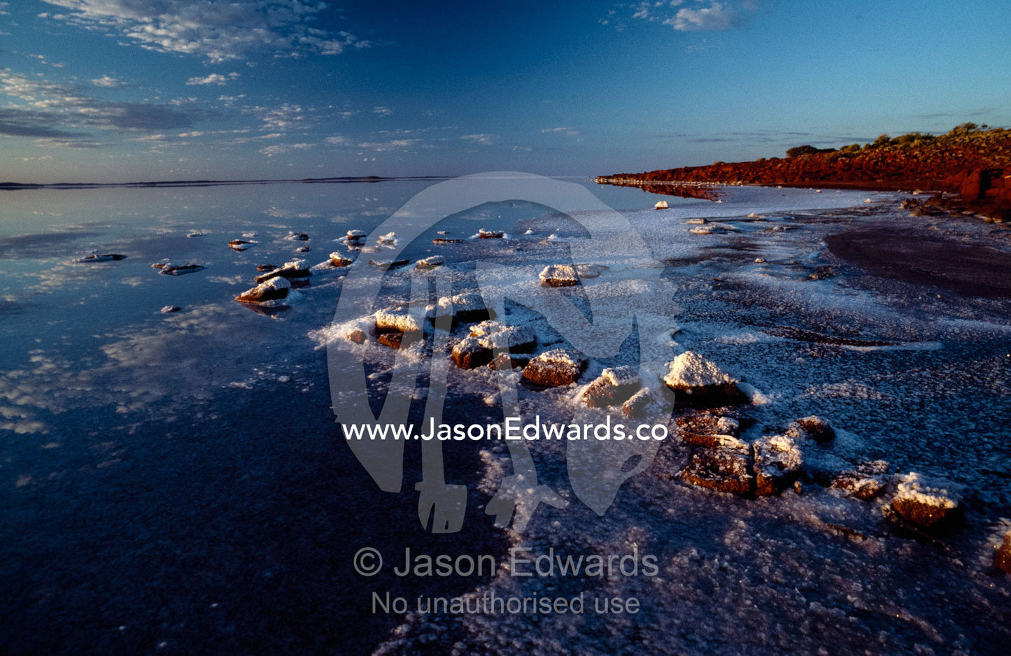 Salt deposits on volcanic rocks on Lake Gairdner. Lake Gairdner, Gawler Ranges National Park, South Australia, Australia.